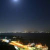 月夜の桜島フェリーと鹿児島市街地夜景