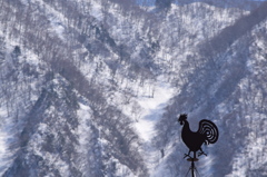 風見鶏と雪山。