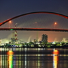 illuminated factories over the bridge