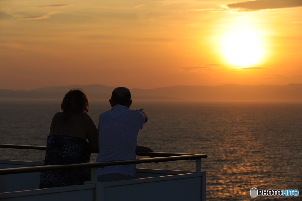 夕日と夫婦
