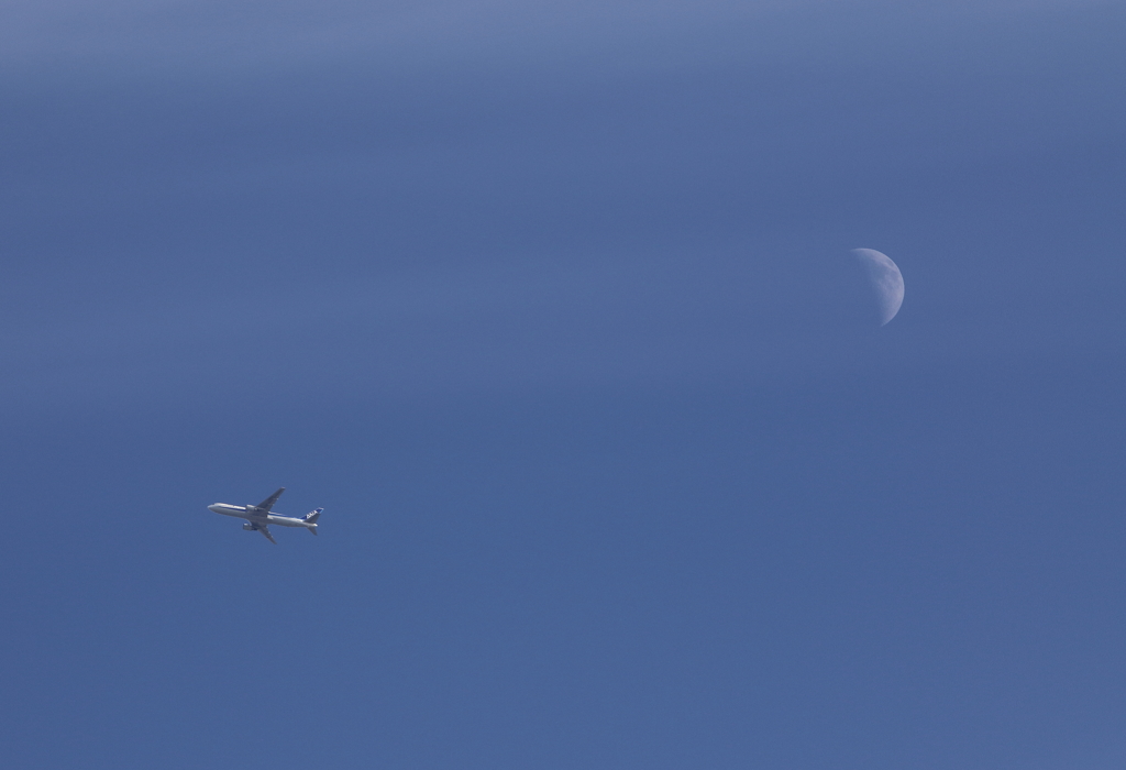 Blue moon with blue plane