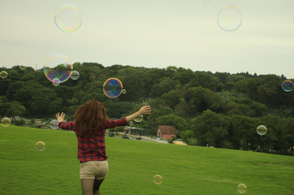 active young girl with soap-bubbles