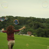 active young girl with soap-bubbles