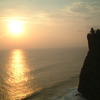 崖の寺院と夕日と海