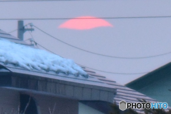 雲の中に沈み行く太陽