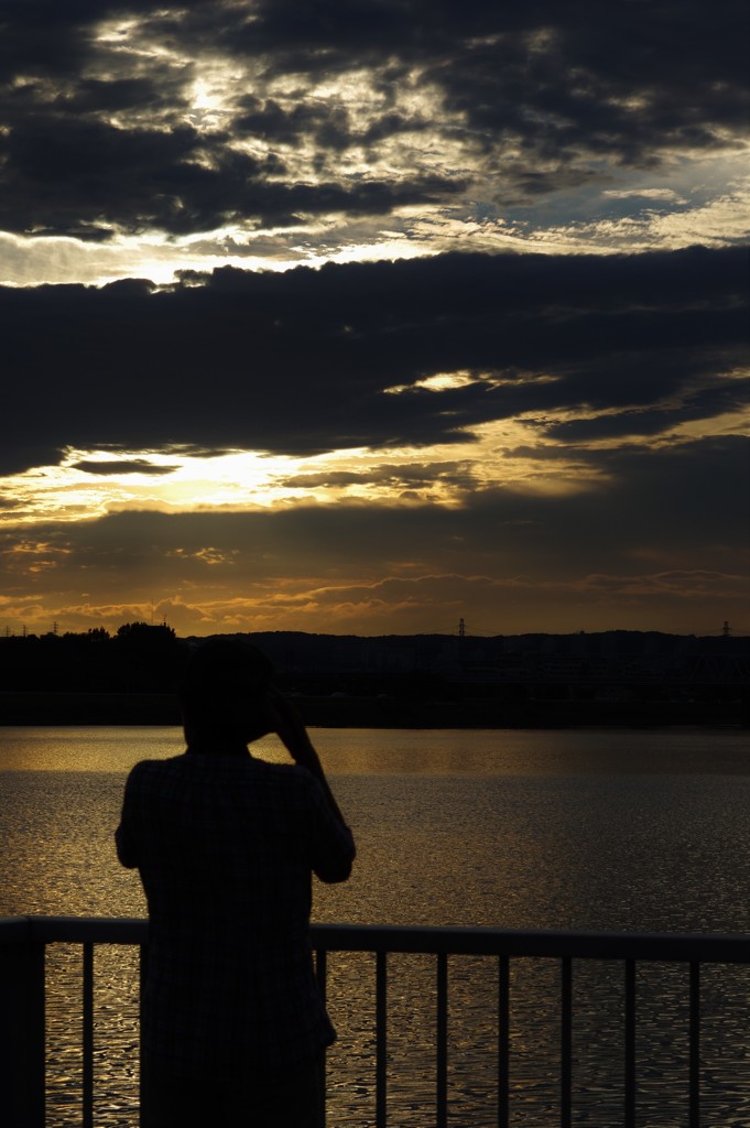 夕日とフォトグラファー