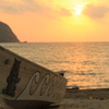 夕日と船